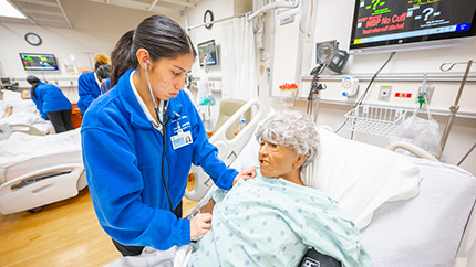 ASPIRE student treating a simulated patient.