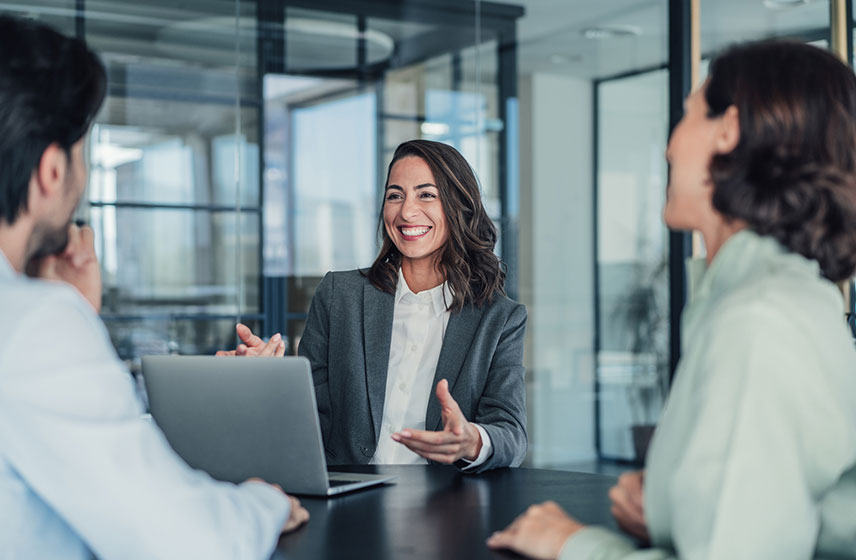 Office professionals gathered for a meeting.