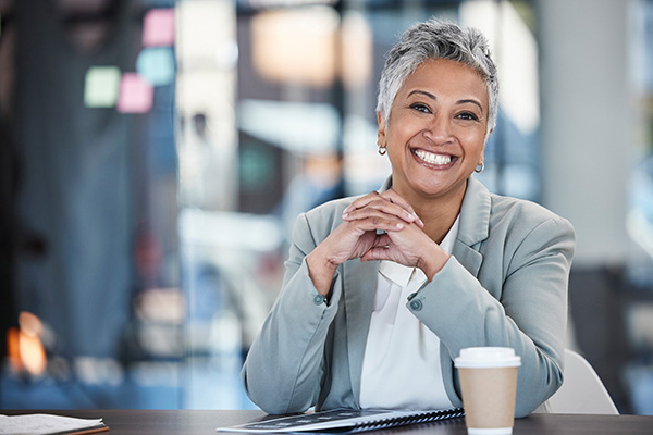 Woman in a business suit sitting at a desk