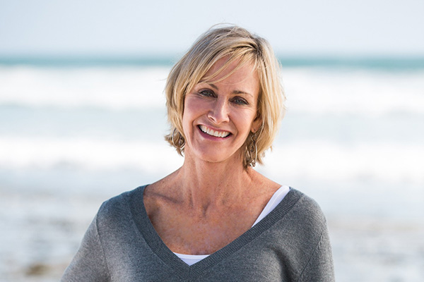 Woman on beach smiling