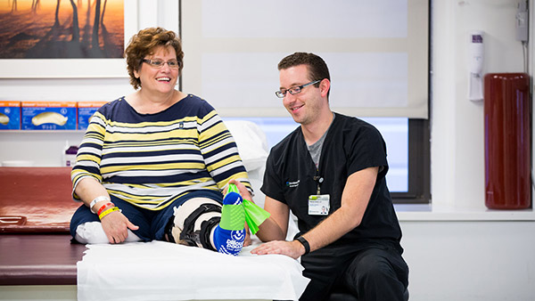 rehabilitation and sports therapist treating amputee patient